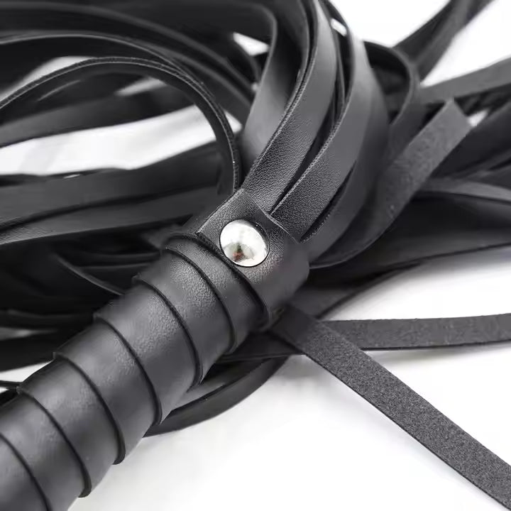 Black leather whip with a metal clip on a white background