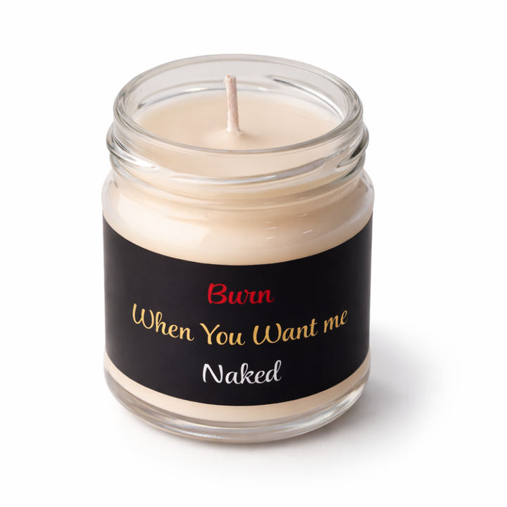 Velence Ignite Candle in soft glass, glowing with warm light, showcasing the "Let Desire Glow" design.