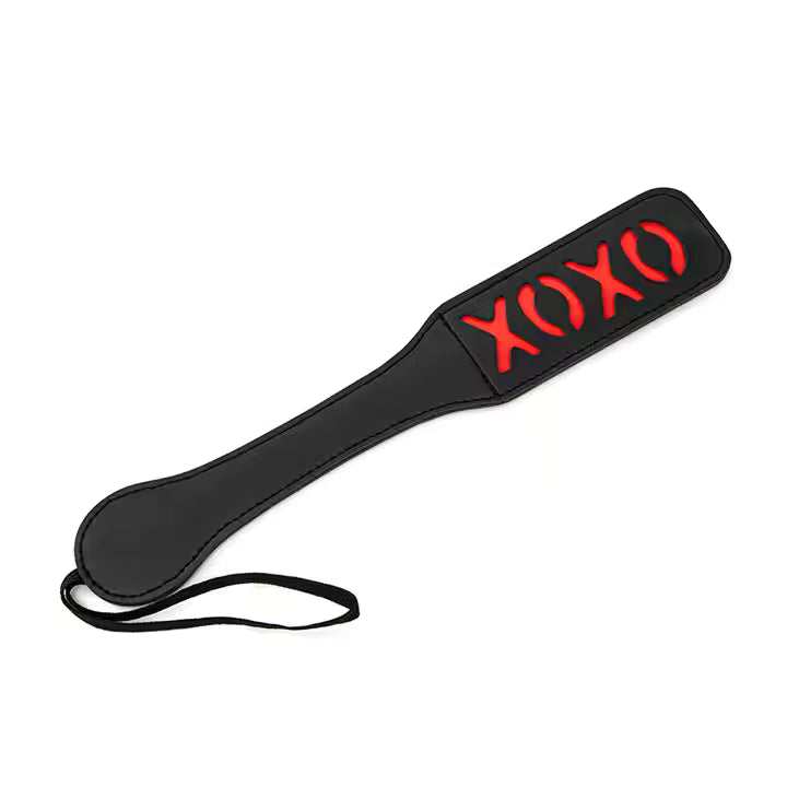 Black paddle with red 'XOXO' text on a white background