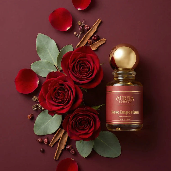 Aurora London Rose Imperium perfume bottle with red roses and spices on a dark background