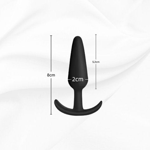 Black silicone butt plug with measurements on a white background