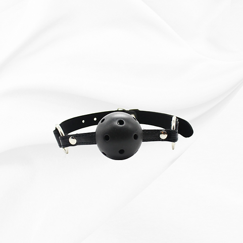 Black leather muzzle with a ball on a white background