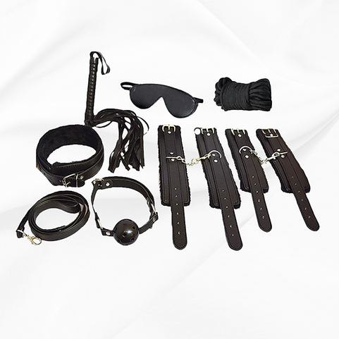 Collection of black bondage accessories on a white background