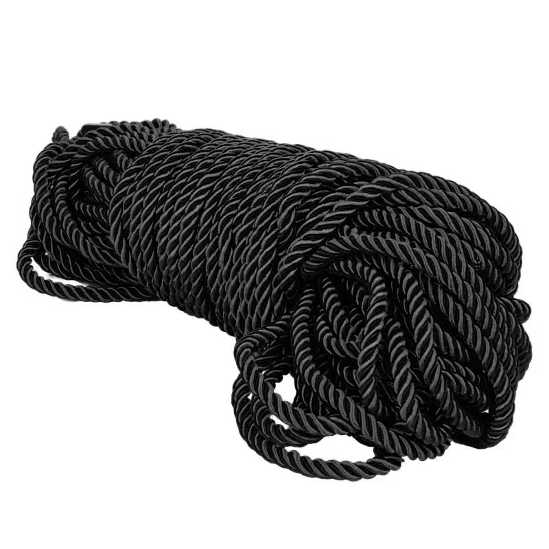 Coiled black rope on a white background