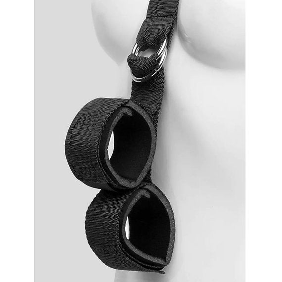 Black wrist restraint with straps on a mannequin arm against a white background