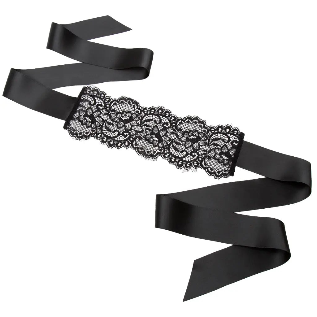 Black lace belt with a black satin ribbon on a white background