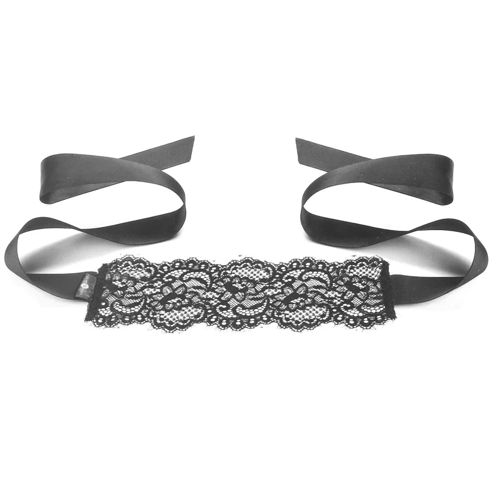 Black lace belt with ribbons on a white background