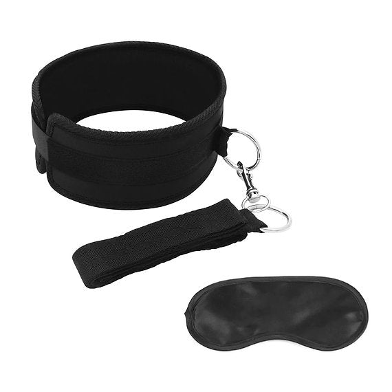 Black neck restraint, leash, and eye mask set on a white background