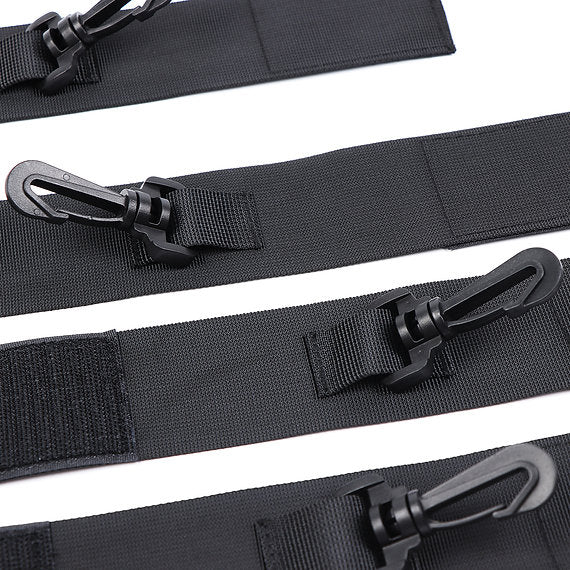 Black straps with metal carabiners on a white background