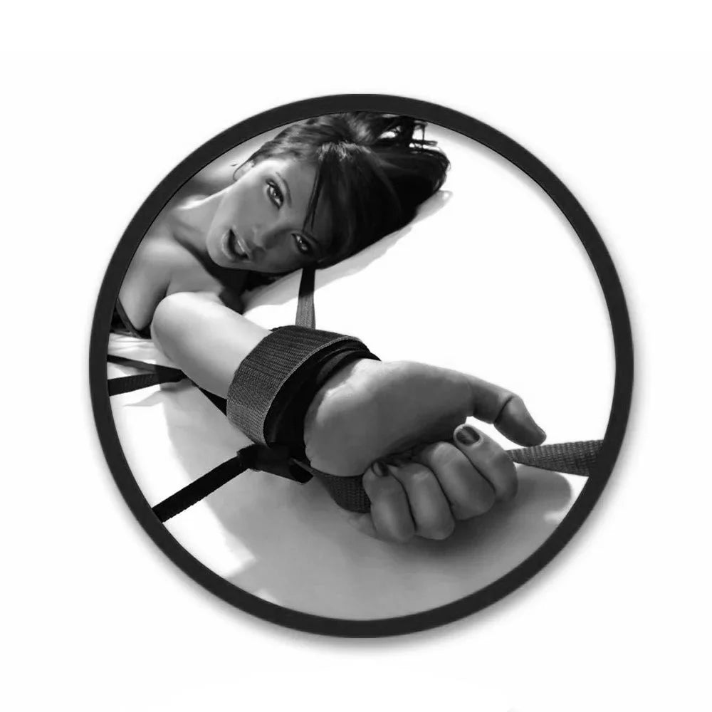 Circular image of a person with a wrist restraint device on a white background