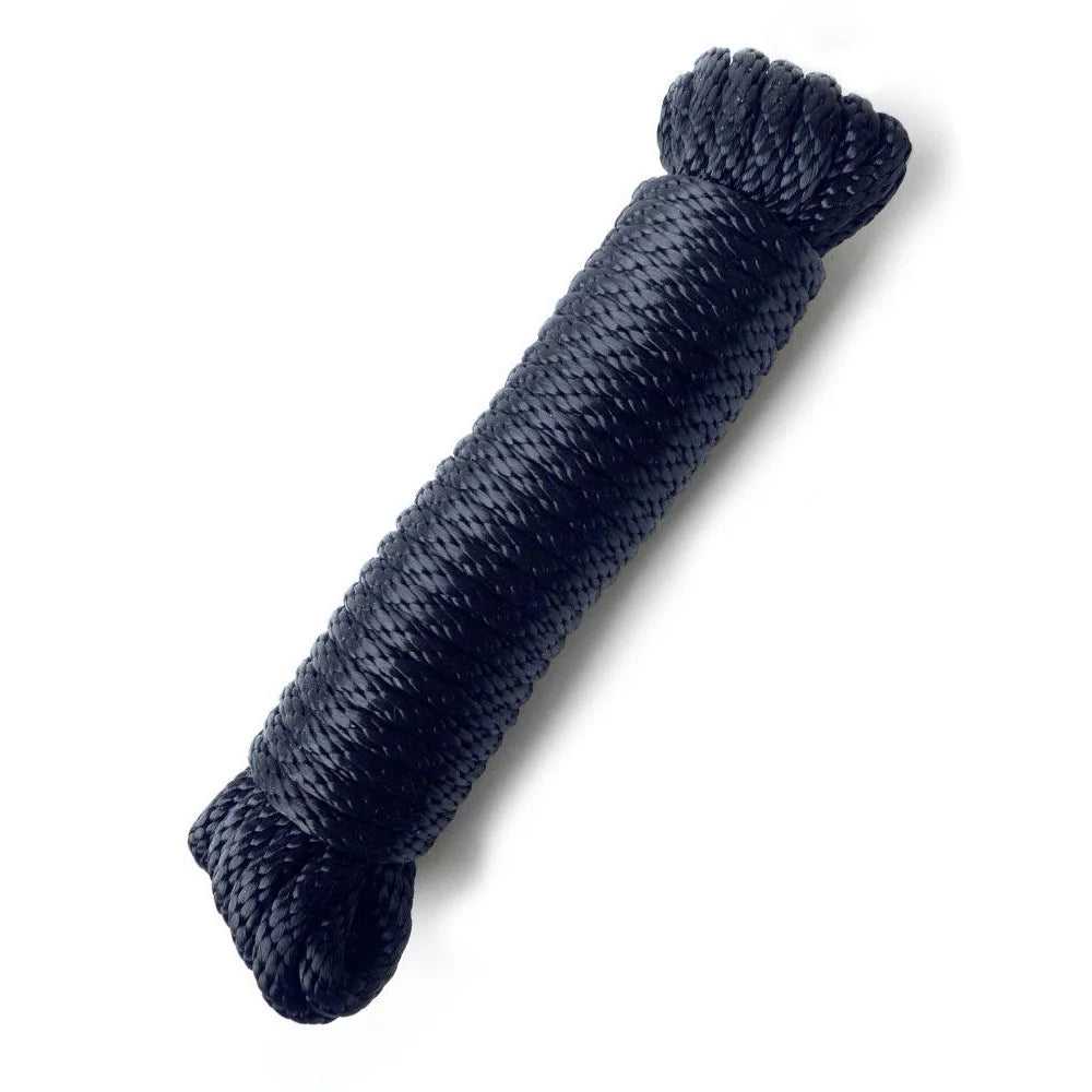 Coiled navy blue rope on a white background