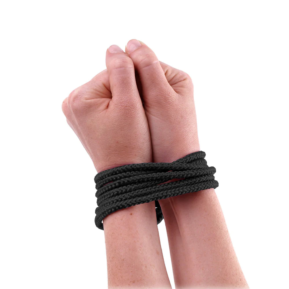Two hands with black wristbands on a white background