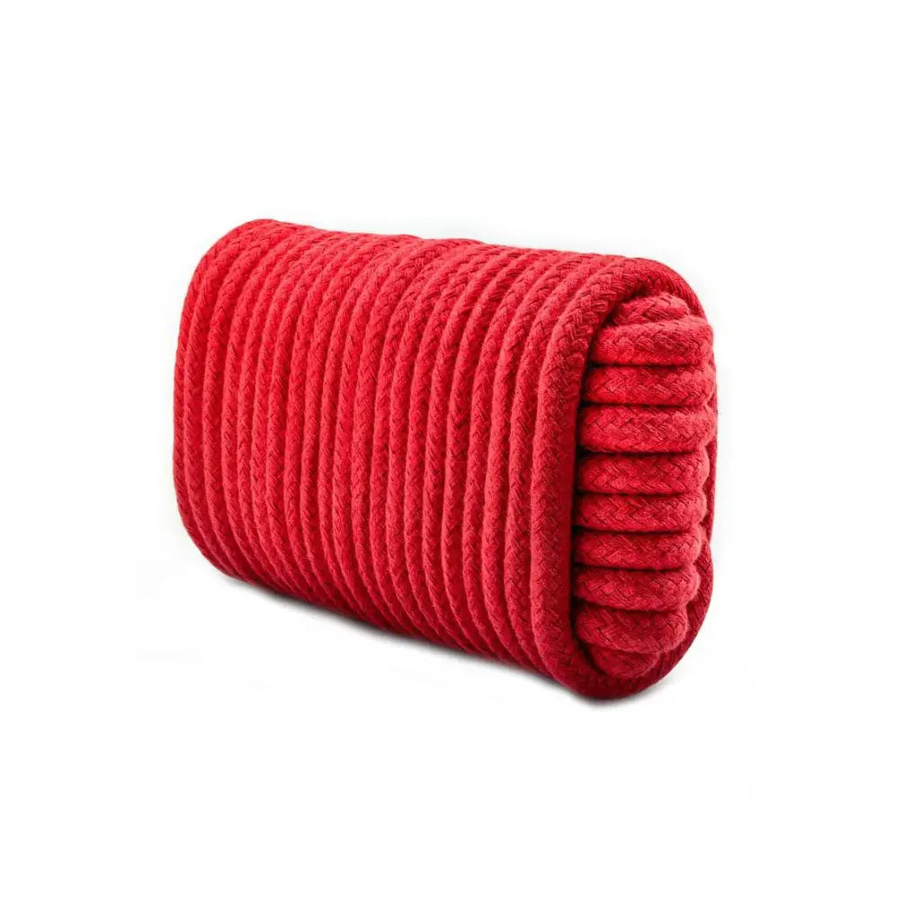 Red textured cylindrical pillow on a white background
