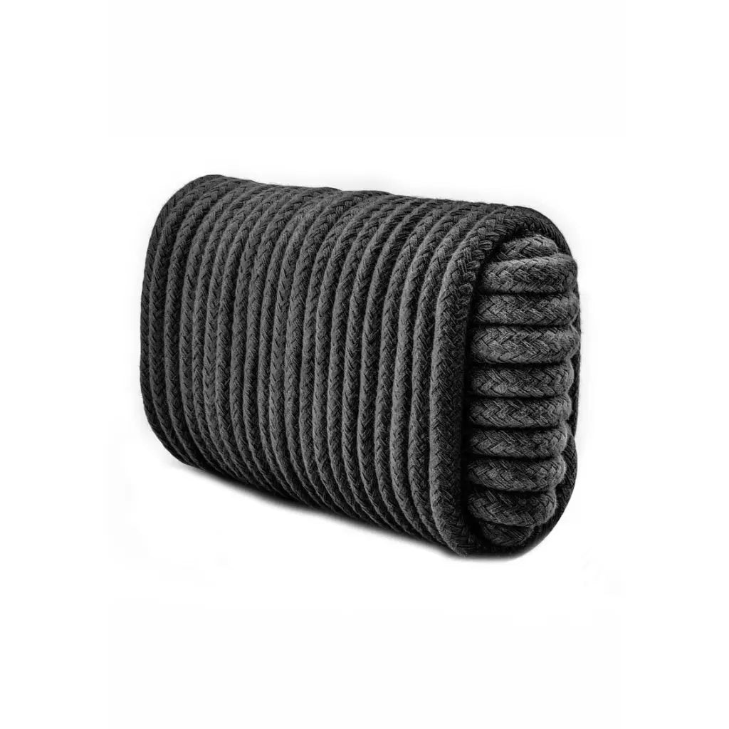 Rolled-up gray rope on a white background