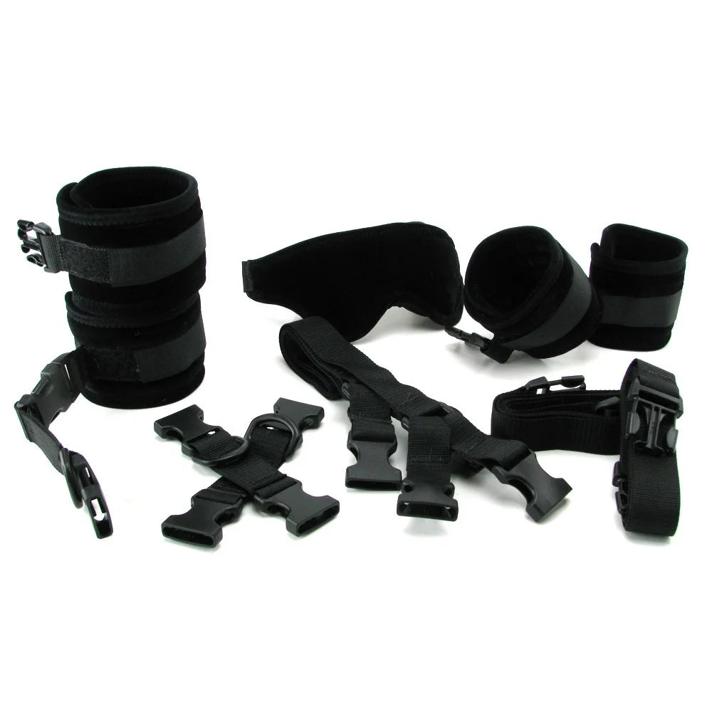 Collection of black restraining straps on a white background